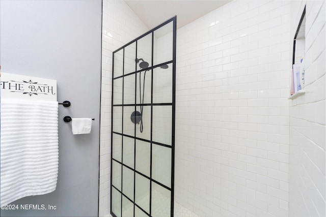 bathroom with a tile shower