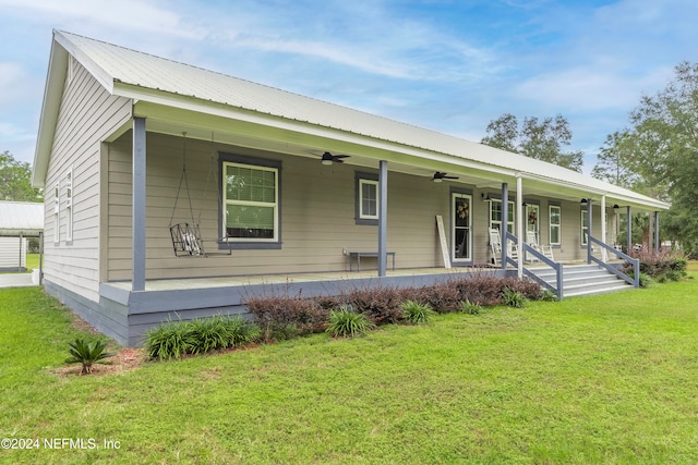 view of front of home featuring a front lawn and a porch