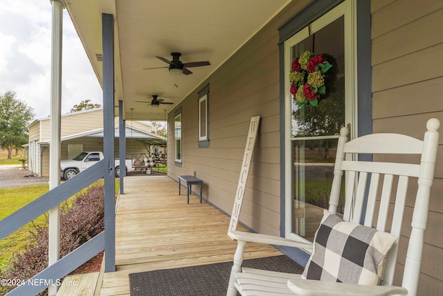 wooden deck with ceiling fan and covered porch