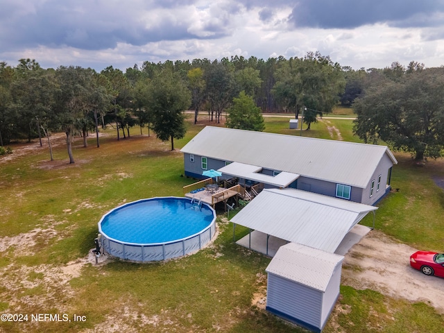 view of swimming pool with an outbuilding