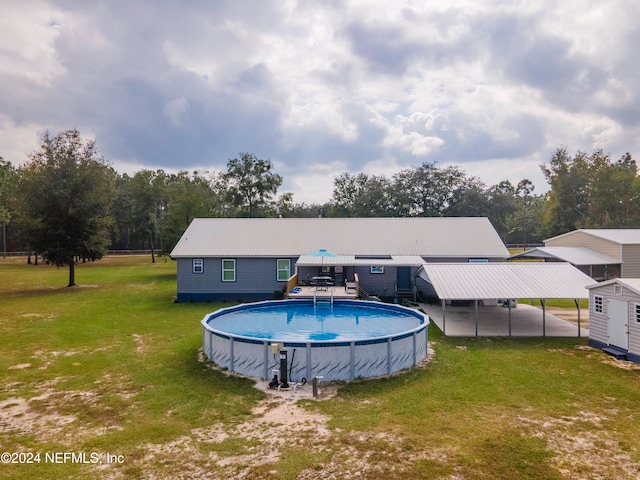 rear view of house featuring a yard