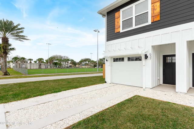 garage featuring a lawn