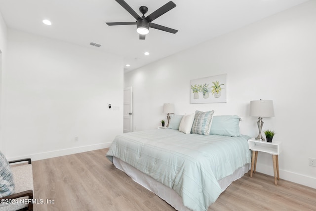 bedroom featuring ceiling fan and light hardwood / wood-style floors