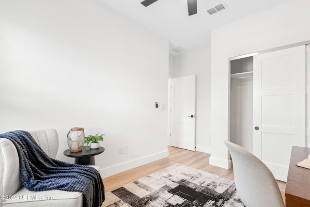 home office featuring ceiling fan and light wood-type flooring