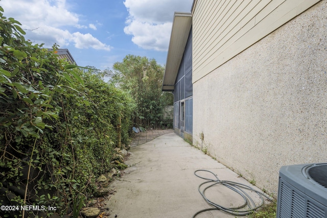 view of side of property with central AC