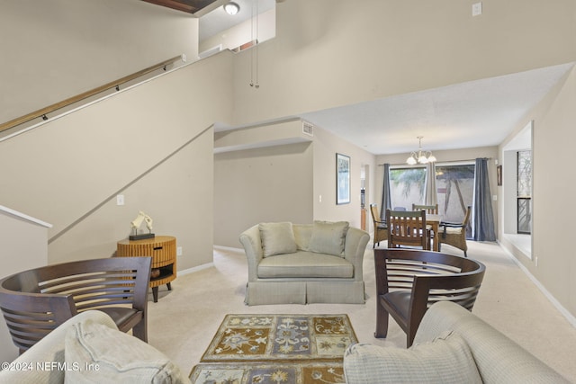 living room with a chandelier and light colored carpet