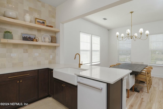 51 Topiary Ave, Saint Augustine, FL 32092 - kitchen with a sink, dishwasher, light wood-type flooring, a peninsula, and a chandelier