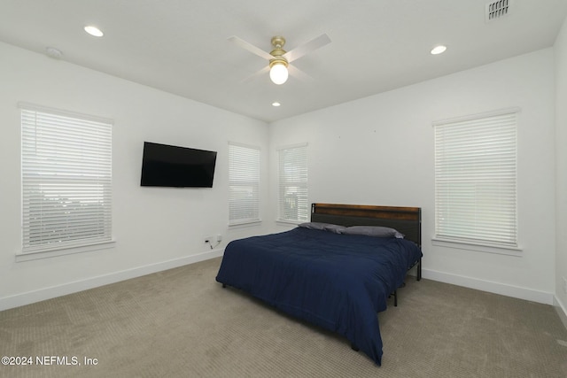 bedroom featuring ceiling fan and light colored carpet