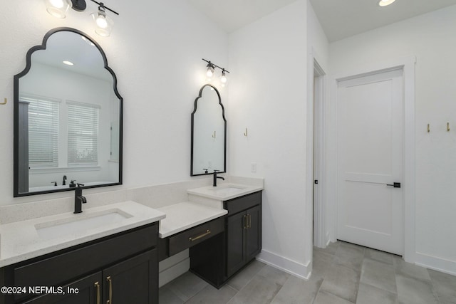 51 Topiary Ave, Saint Augustine, FL 32092 - bathroom with double vanity, baseboards, and tile patterned flooring