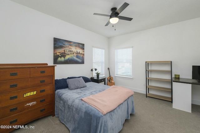 bedroom featuring ceiling fan and light colored carpet