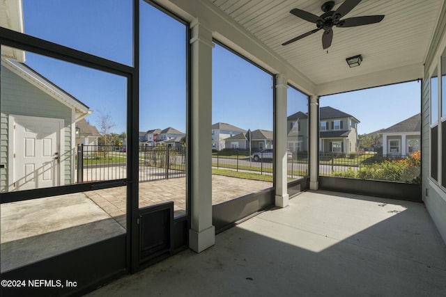 sunroom with plenty of natural light and ceiling fan