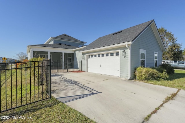 51 Topiary Ave, Saint Augustine, FL 32092 - view of front of property featuring an attached garage, concrete driveway, covered porch, a gate, and roof with shingles