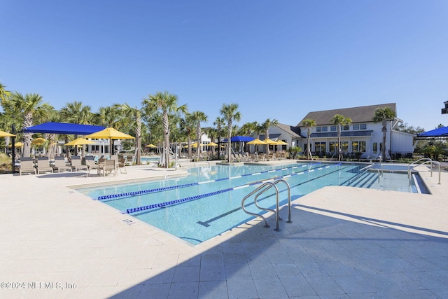 view of swimming pool with a patio