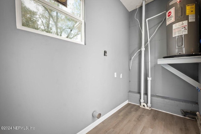 utility room featuring water heater