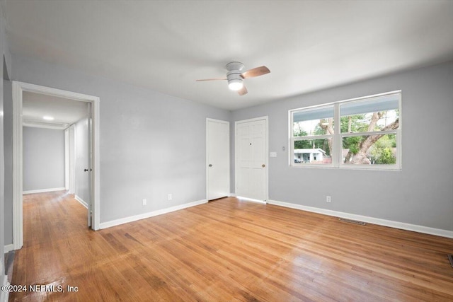 spare room featuring ceiling fan and light wood-type flooring