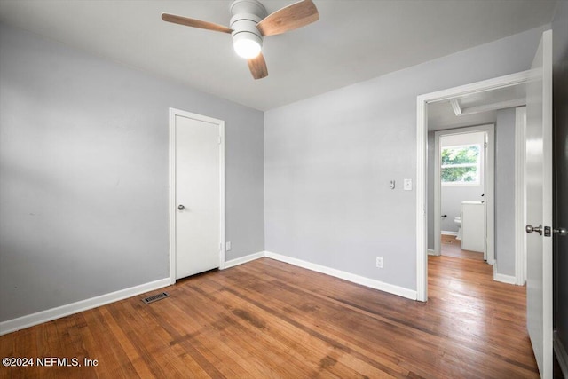 unfurnished room featuring hardwood / wood-style floors and ceiling fan