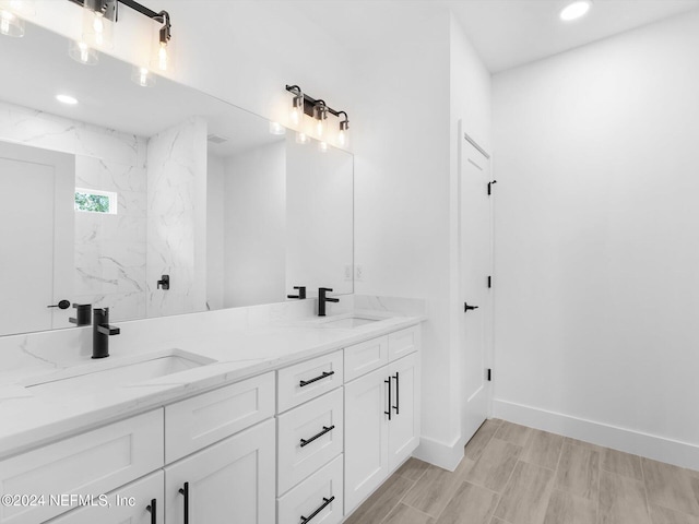 bathroom featuring hardwood / wood-style floors and vanity