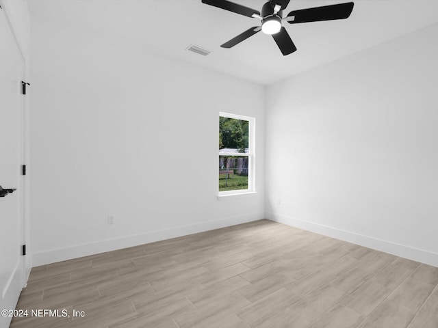 unfurnished room with ceiling fan and light hardwood / wood-style flooring