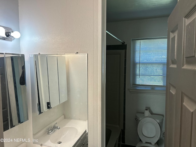 full bathroom featuring vanity, toilet, and tub / shower combination