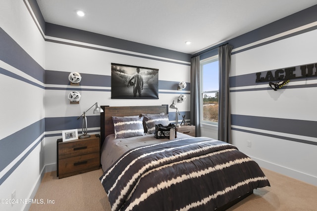 bedroom featuring light carpet