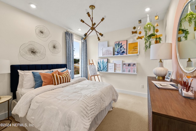 bedroom featuring a chandelier and light carpet