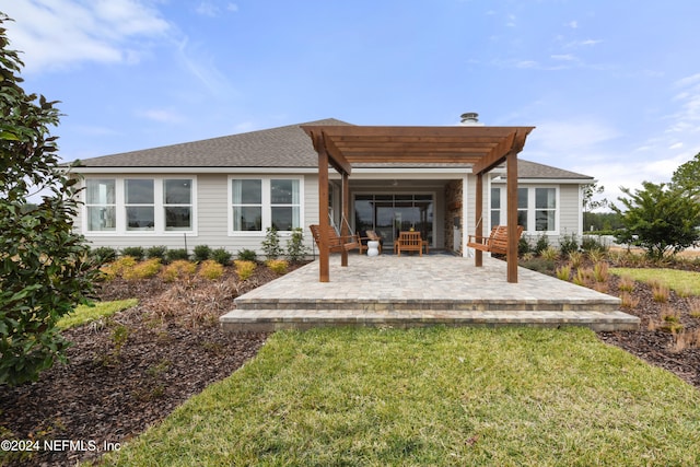 rear view of property featuring a patio area, a lawn, and a pergola