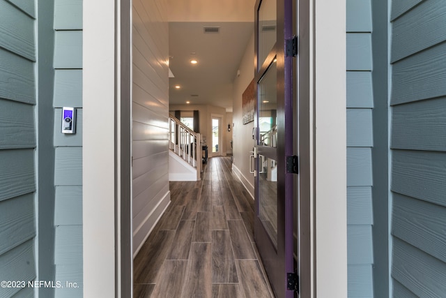 hall with dark wood-type flooring