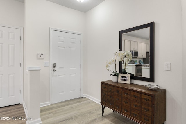 entrance foyer with light wood-type flooring