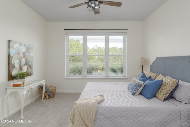 bedroom featuring light colored carpet and ceiling fan