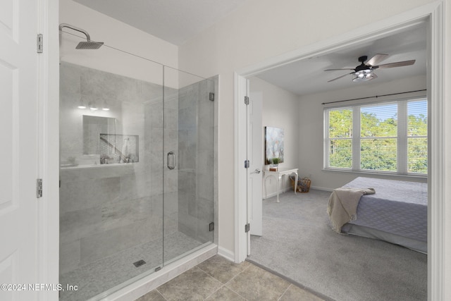 bathroom featuring tile patterned floors, ceiling fan, and a shower with shower door