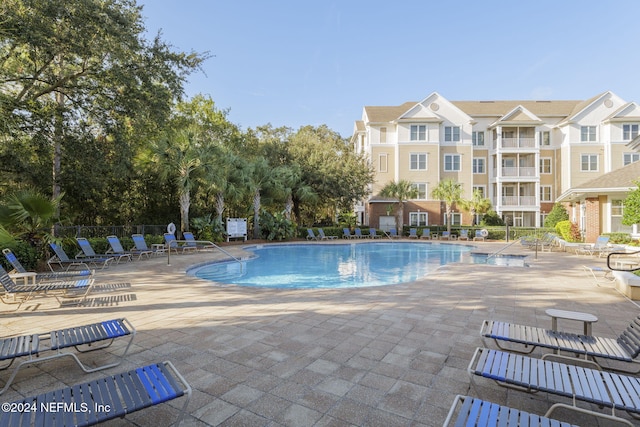 view of pool featuring a patio area