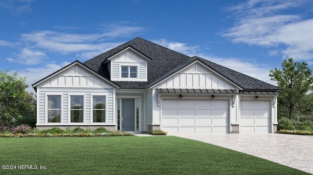 view of front of house featuring a garage and a front lawn