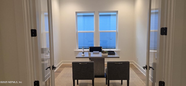 home office with french doors and baseboards