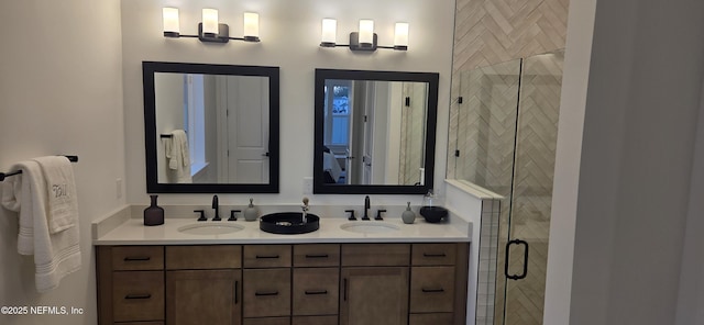 bathroom featuring double vanity, a sink, and a shower stall