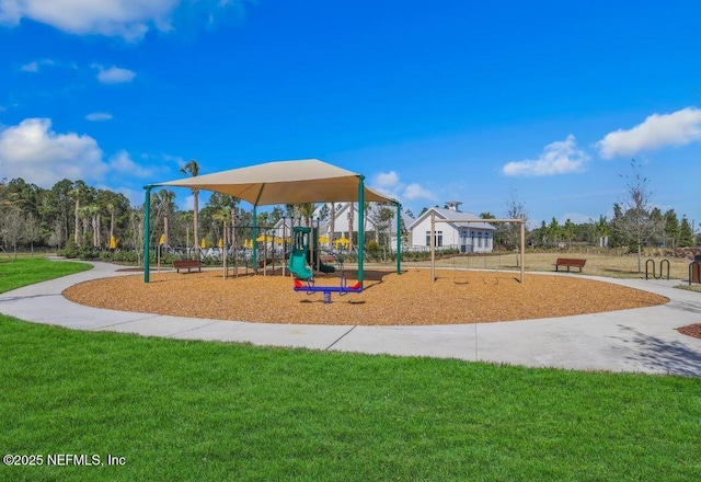 community play area with a lawn