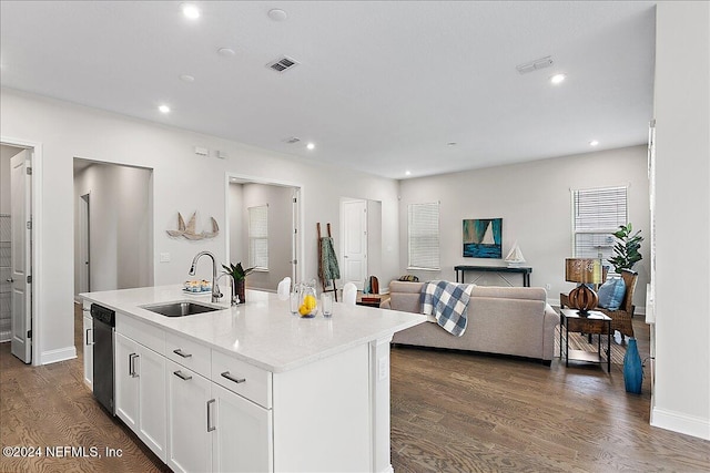 kitchen featuring dark hardwood / wood-style flooring, sink, an island with sink, white cabinets, and stainless steel dishwasher