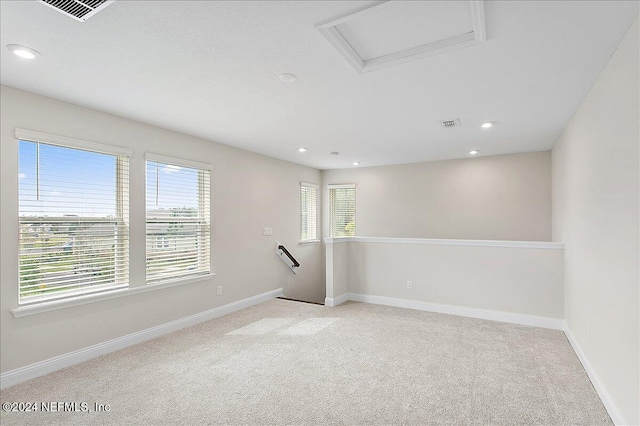 empty room featuring light colored carpet