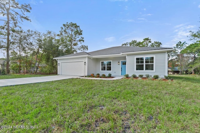 ranch-style home with a garage and a front yard