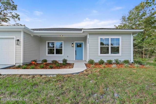 ranch-style home with a garage