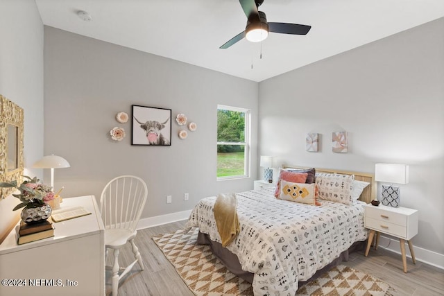 bedroom featuring light hardwood / wood-style flooring and ceiling fan