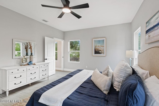 bedroom featuring light hardwood / wood-style flooring and ceiling fan