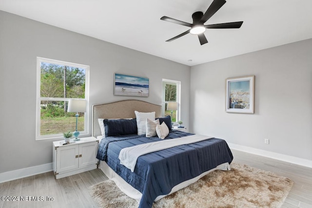 bedroom featuring light hardwood / wood-style floors and ceiling fan