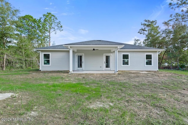 back of house with ceiling fan and a patio