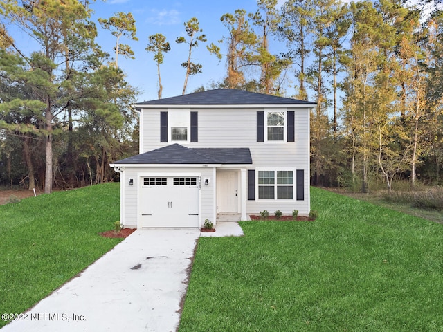 view of property with a garage and a front yard