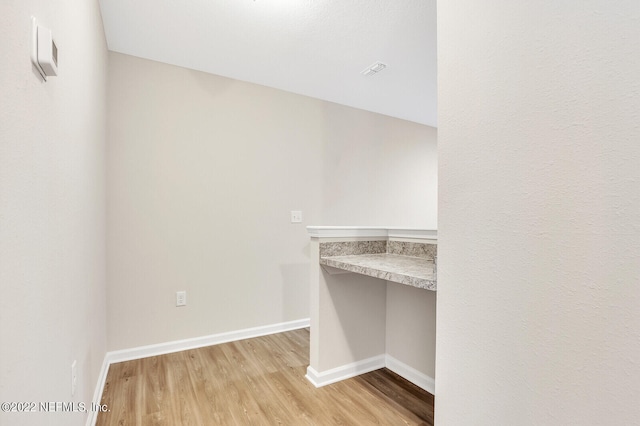 interior space featuring light hardwood / wood-style floors and built in desk