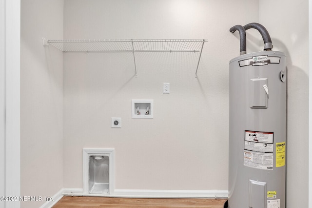 washroom with washer hookup, wood-type flooring, electric water heater, and hookup for an electric dryer