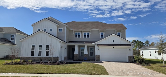 view of front of home with a standing seam roof, stone siding, board and batten siding, and a front yard