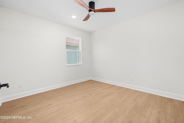 unfurnished room with ceiling fan and light hardwood / wood-style floors