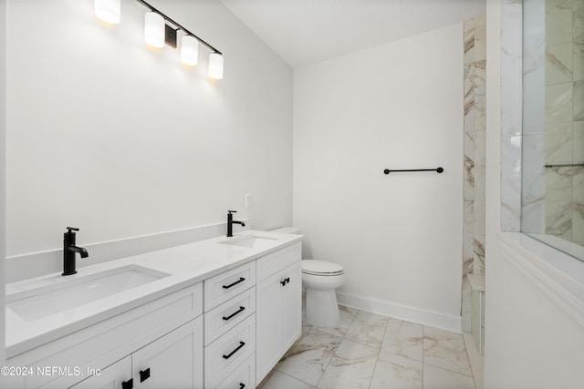 bathroom with vanity, toilet, and tiled shower