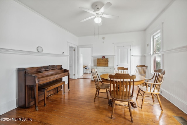 dining area featuring hardwood / wood-style floors and ceiling fan